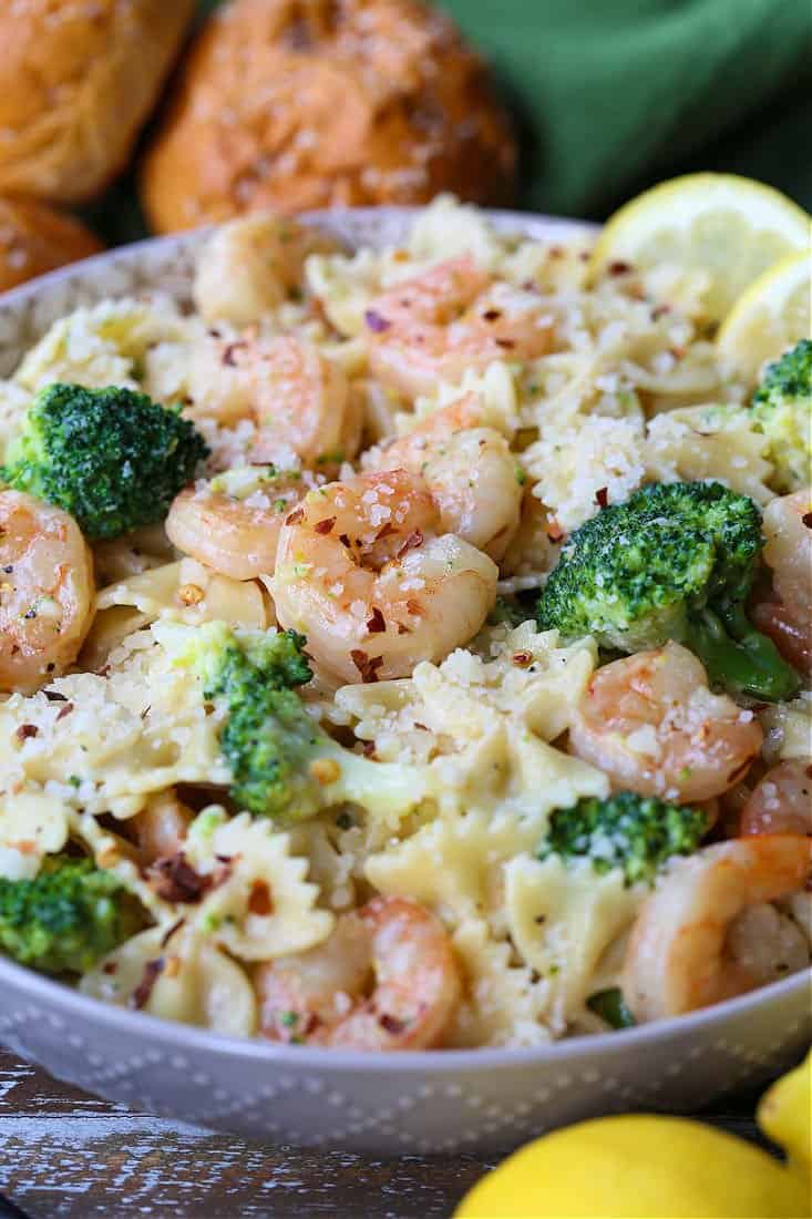 Shrimp and Broccoli Pasta has the most delicious, lemon cream sauce that coats every bit of pasta! A light pasta dinner that everyone loves! shrimp and bowtie pasta with brocoli