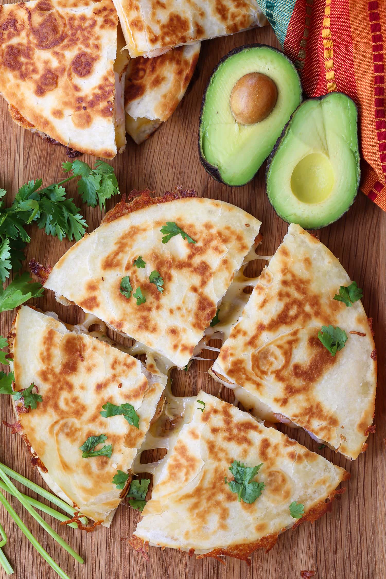 shrimp quesadilla cut into fourths on board