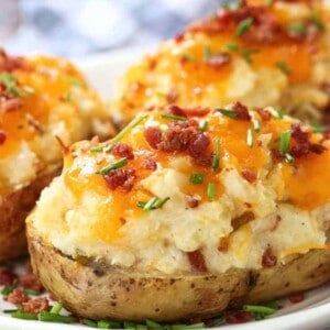 Twice Baked potatoes on a plate with checkered napkin