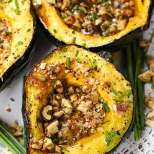 Acorn squash filled with brown sugar and walnuts.