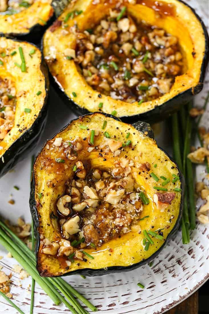 Acorn squash filled with brown sugar and walnuts.