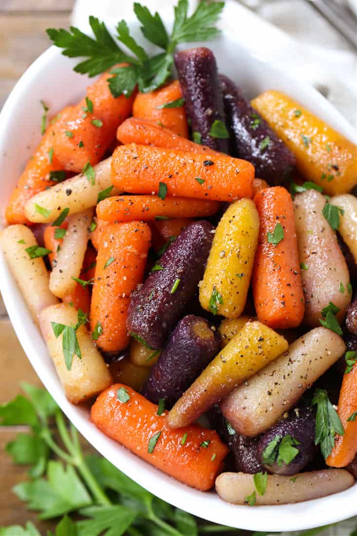 Honey Glazed Carrots in a serving dish with parsley