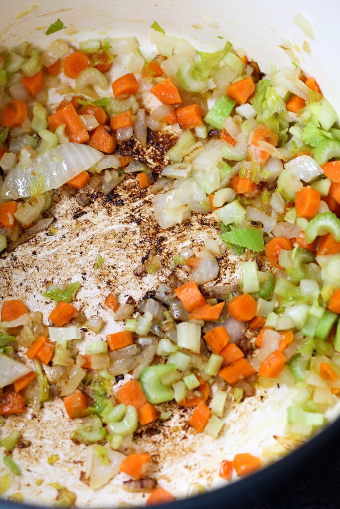 diced carrots, celery and onions in a soup pot