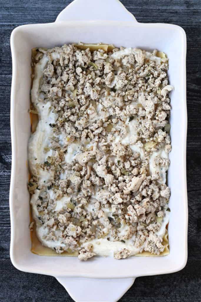 ground turkey layered on top of cheese and pasta