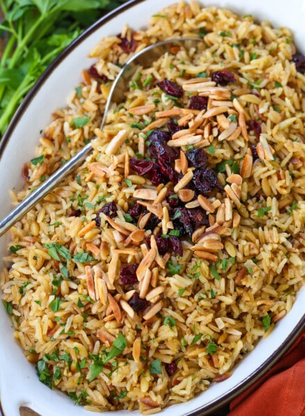 rice pilaf in serving dish with spoon