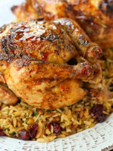 roasted cornish hen with bourbon glaze on bed of rice