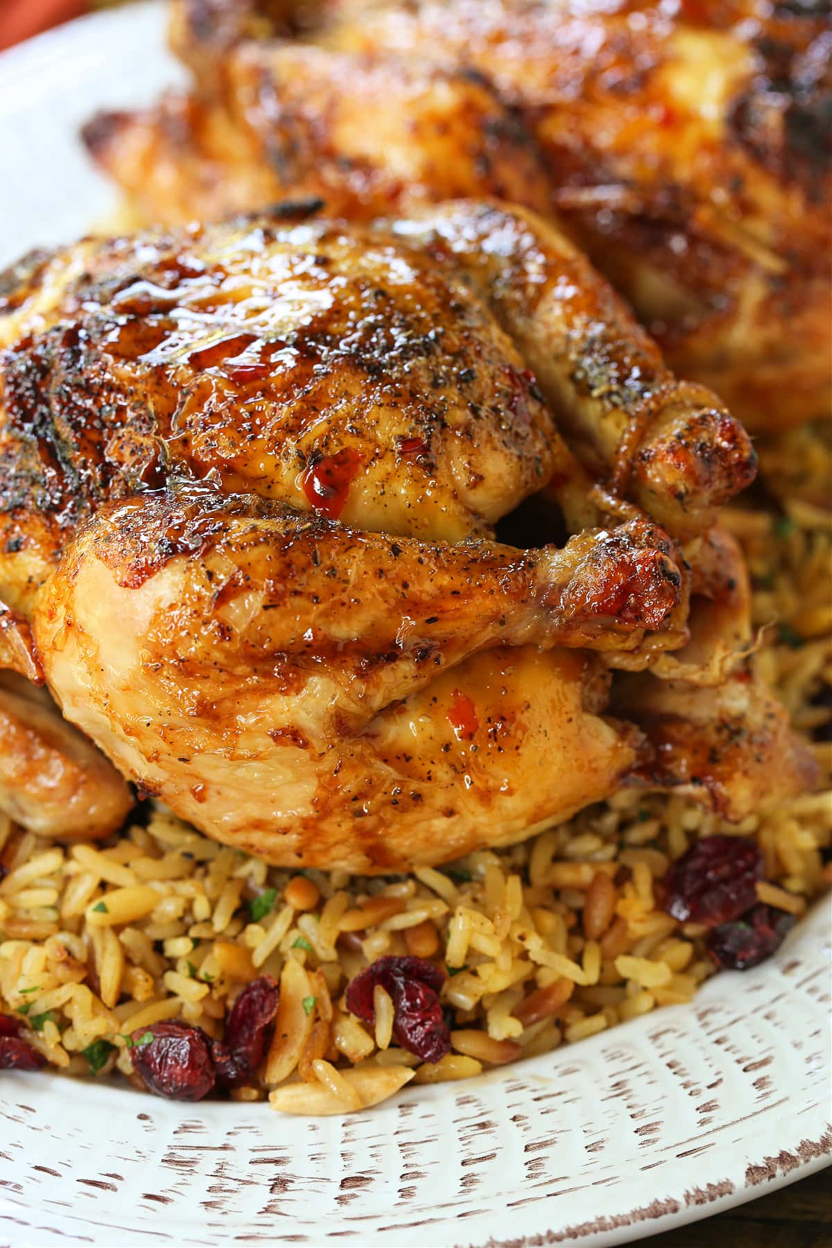 roasted cornish hen with bourbon glaze on bed of rice