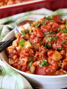 Bowl with cabbage roll casserole and green napkin