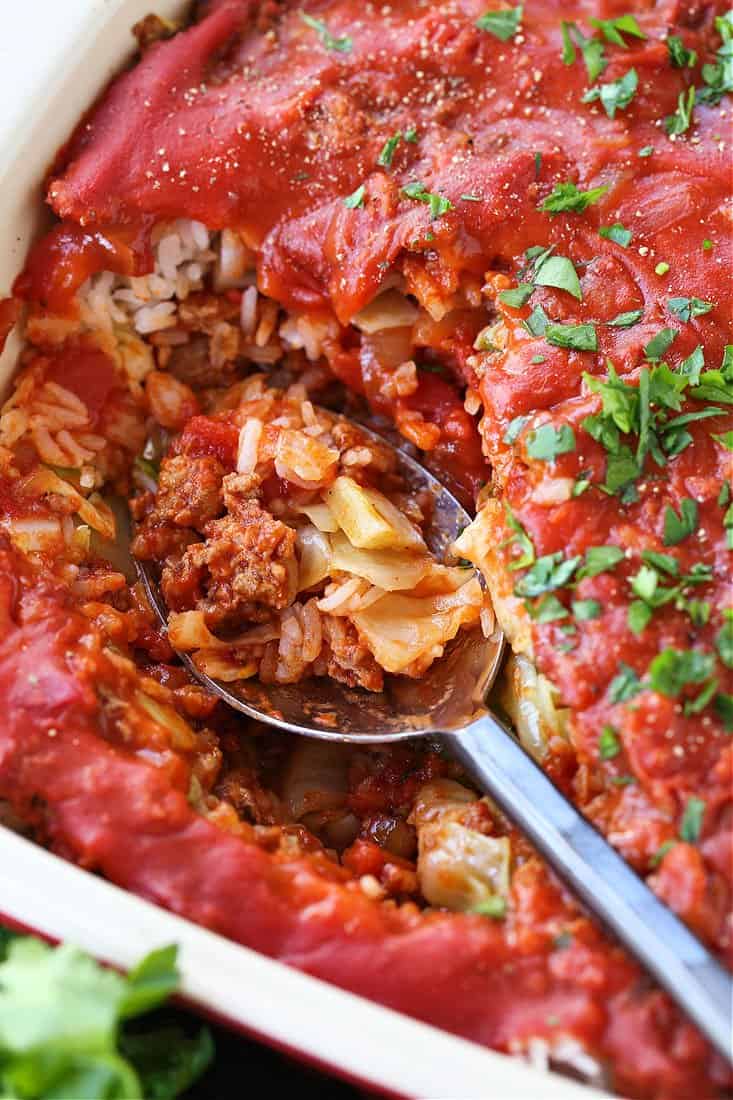 This Cabbage Roll Casserole is a comforting, easy to make dinner recipe! All your favorite cabbage roll ingredients in a delicious, easy casserole! Spoon in a baking dish with casserole