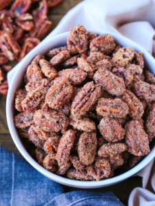 candied pecans in a white bowl with napkin