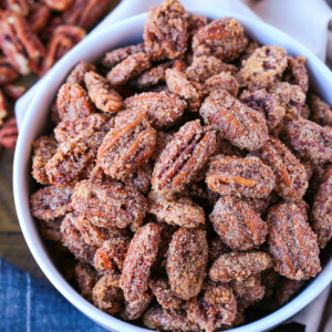 candied pecans in a white bowl with napkin