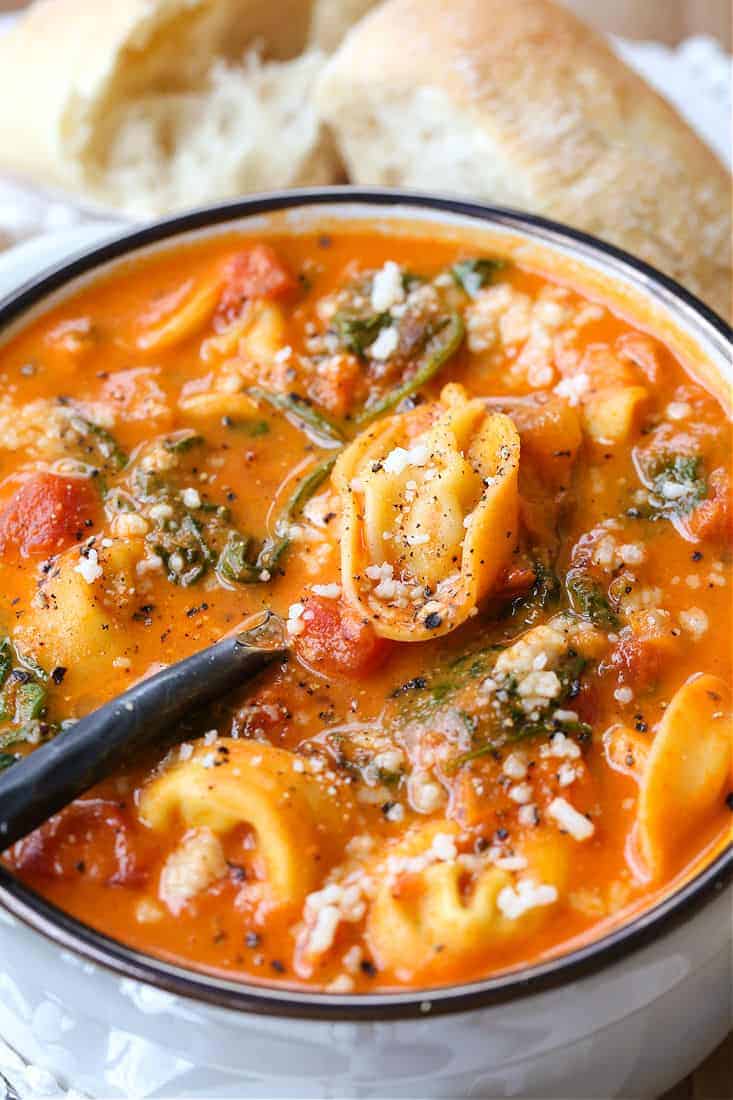 Creamy tomato soup with fresh tortellini and spinach