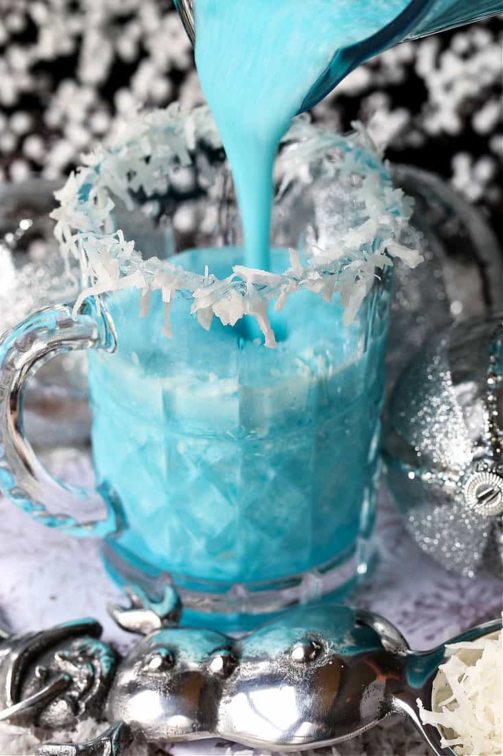 Jack Frost cocktail pouring into a glass