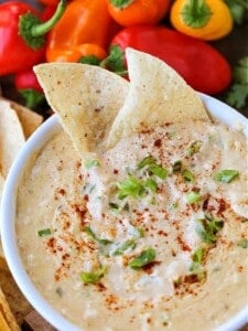 Tex-Mex Crab Dip in a white bowl with tortilla chips