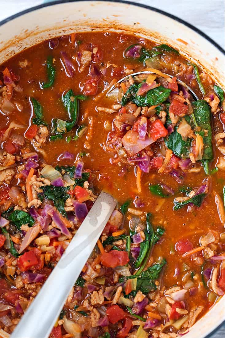 Ladle in a pot with cabbage soup