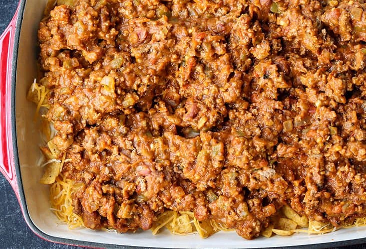 Ground beef filling layered on Frito chips and cheese