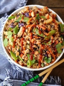 Peanut Chicken Fried Rice in a white bowl with napkin