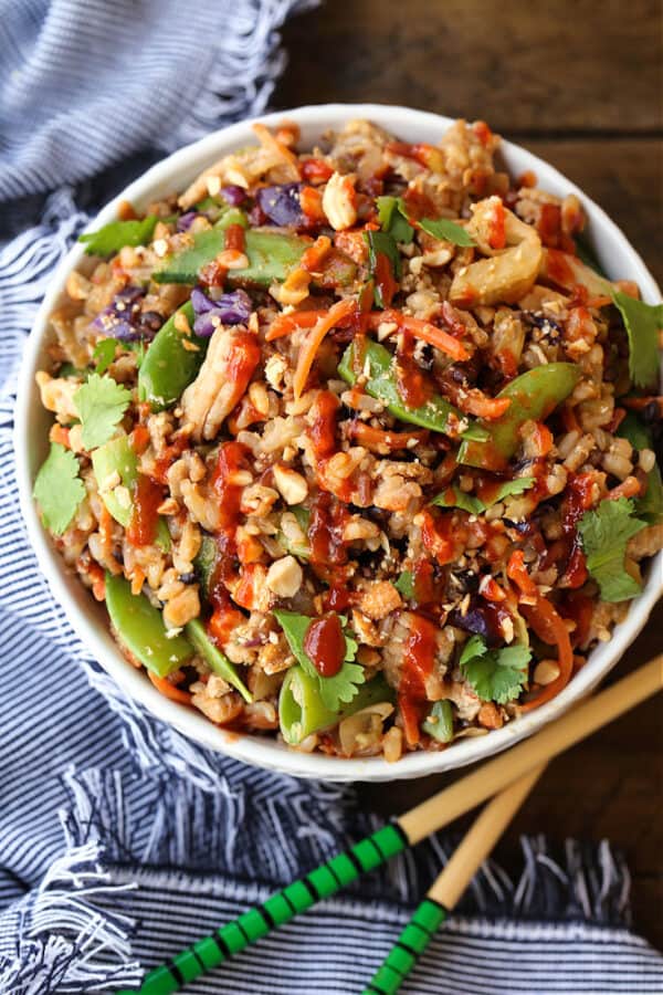Peanut Chicken Fried Rice in a white bowl with napkin