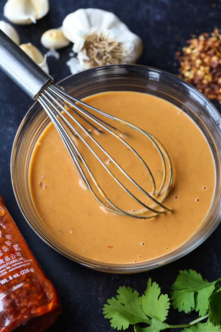 Peanut sauce with ingredients for making peanut chicken fried rice