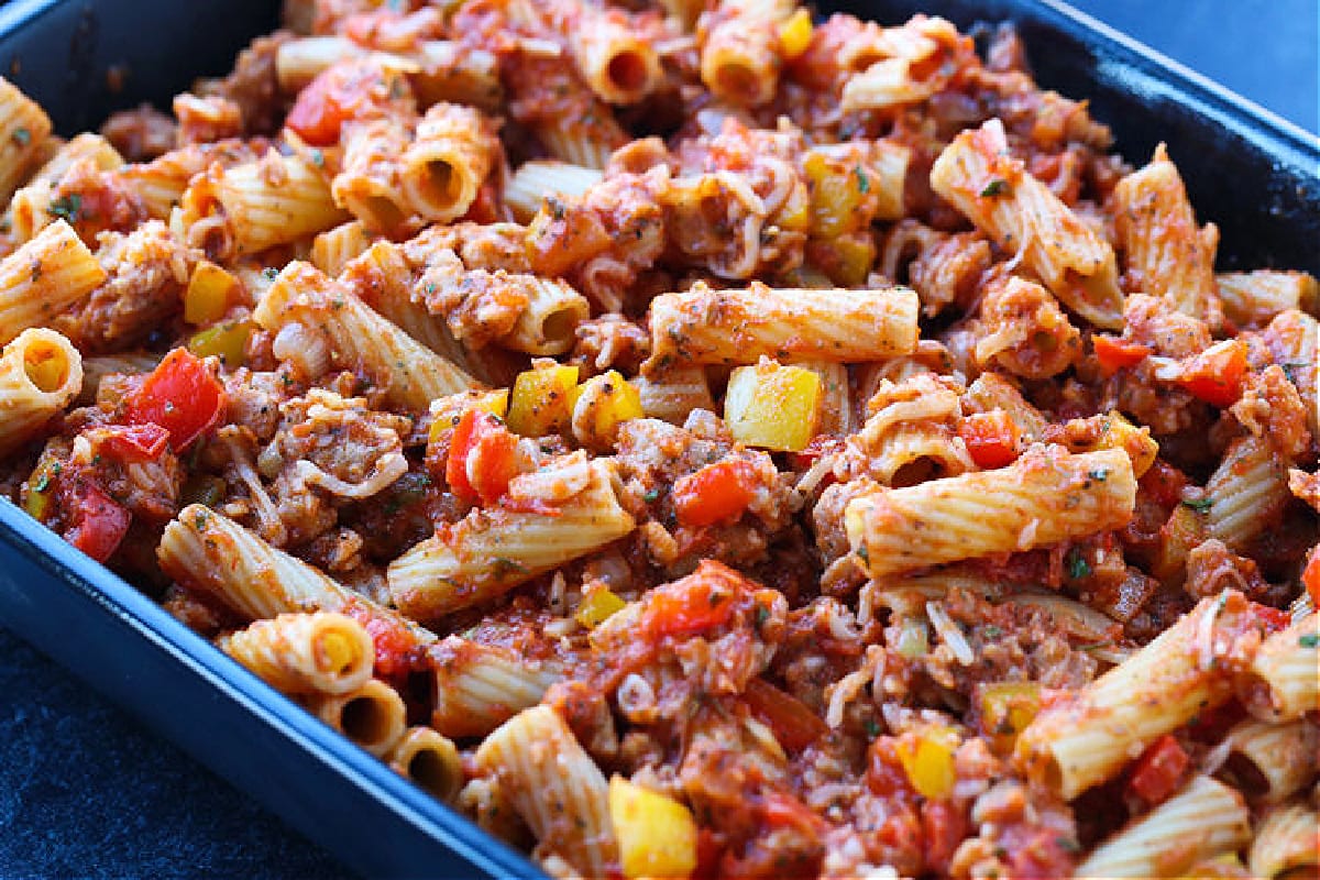 sausage and peppers baked ziti in casserole dish
