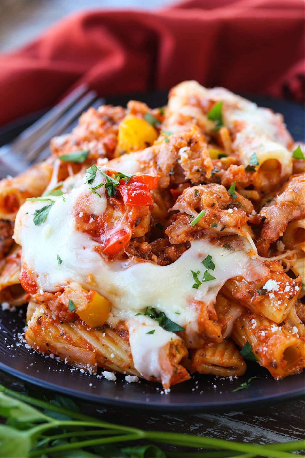 baked ziti with sausage and peppers on plate