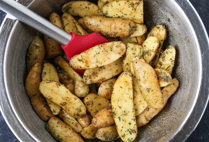 Fingerling potatoes with seasonings in a bowl