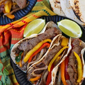 Fajitas on a plate with all the fixings