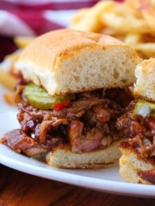 BBQ Rib Sandwich sliced in half on a plate