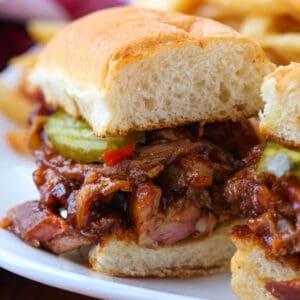 BBQ Rib Sandwich sliced in half on a plate