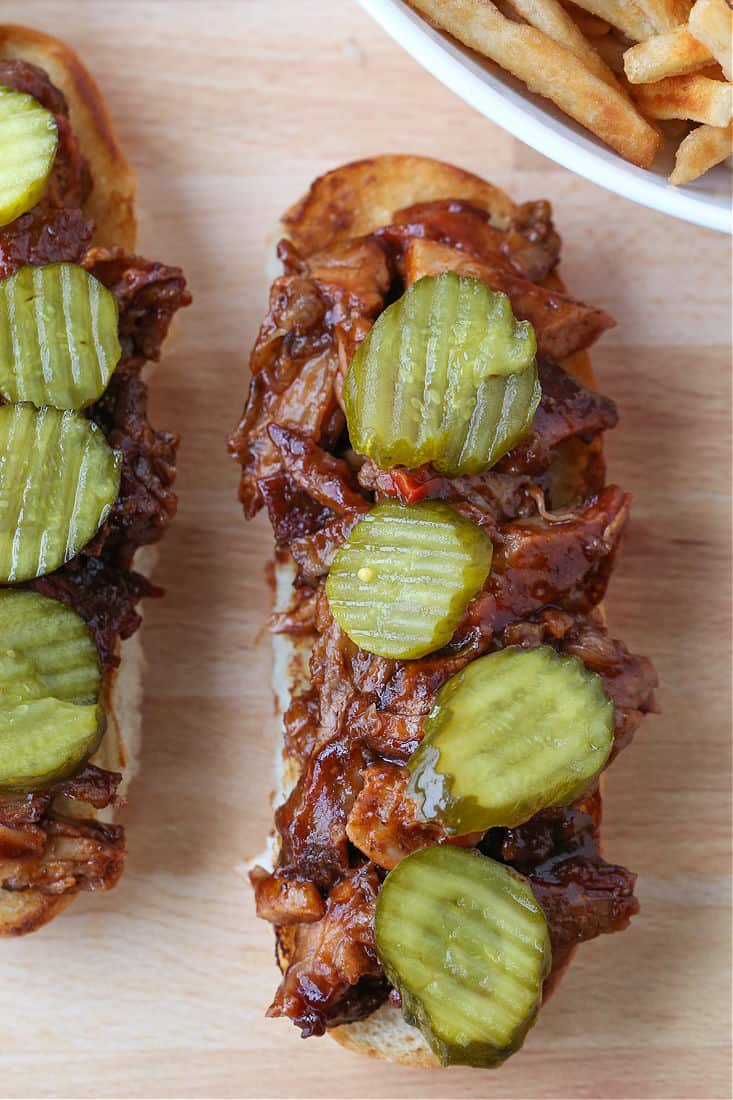 BBQ Rib Sandwiches being made with pickles