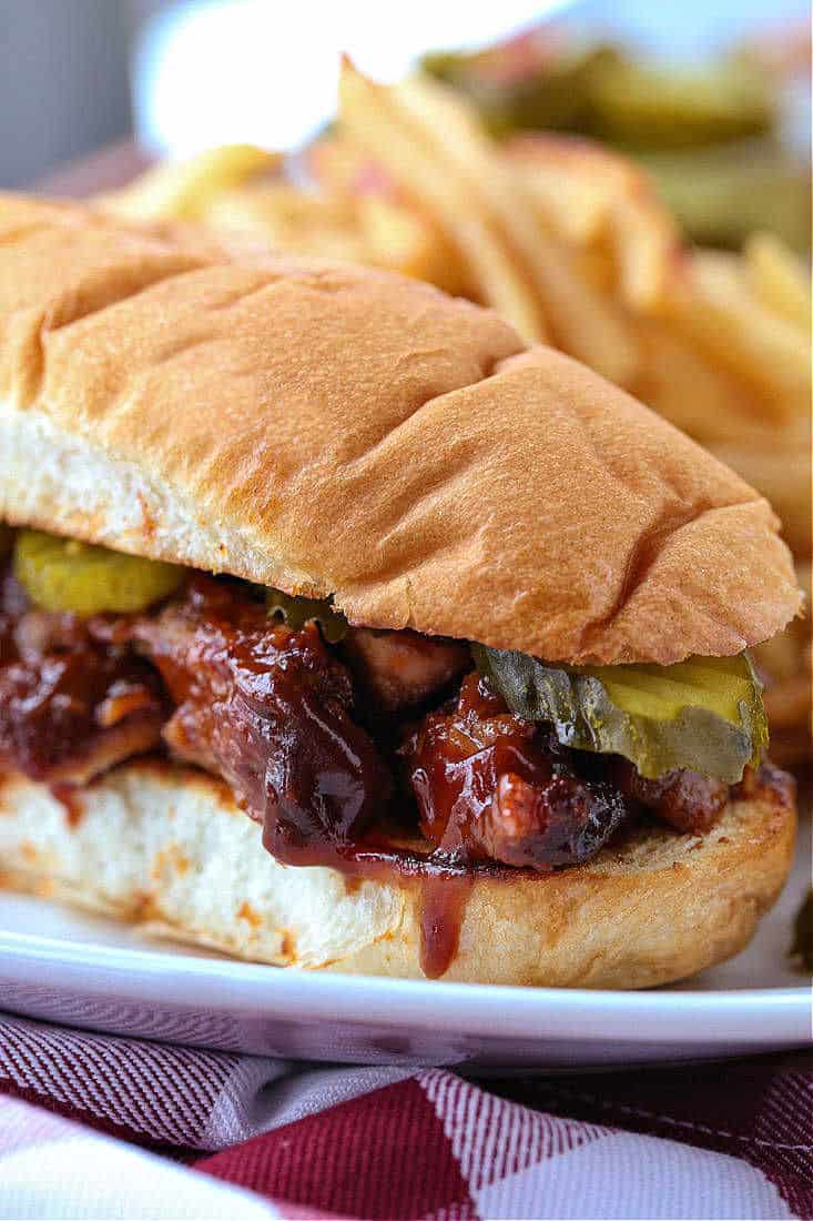 BBQ Rib Sandwich on a plate with fries
