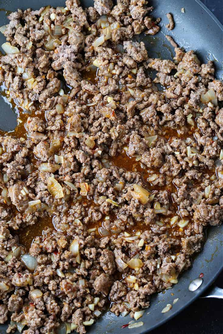 ground beef in a skillet with Asian sauce