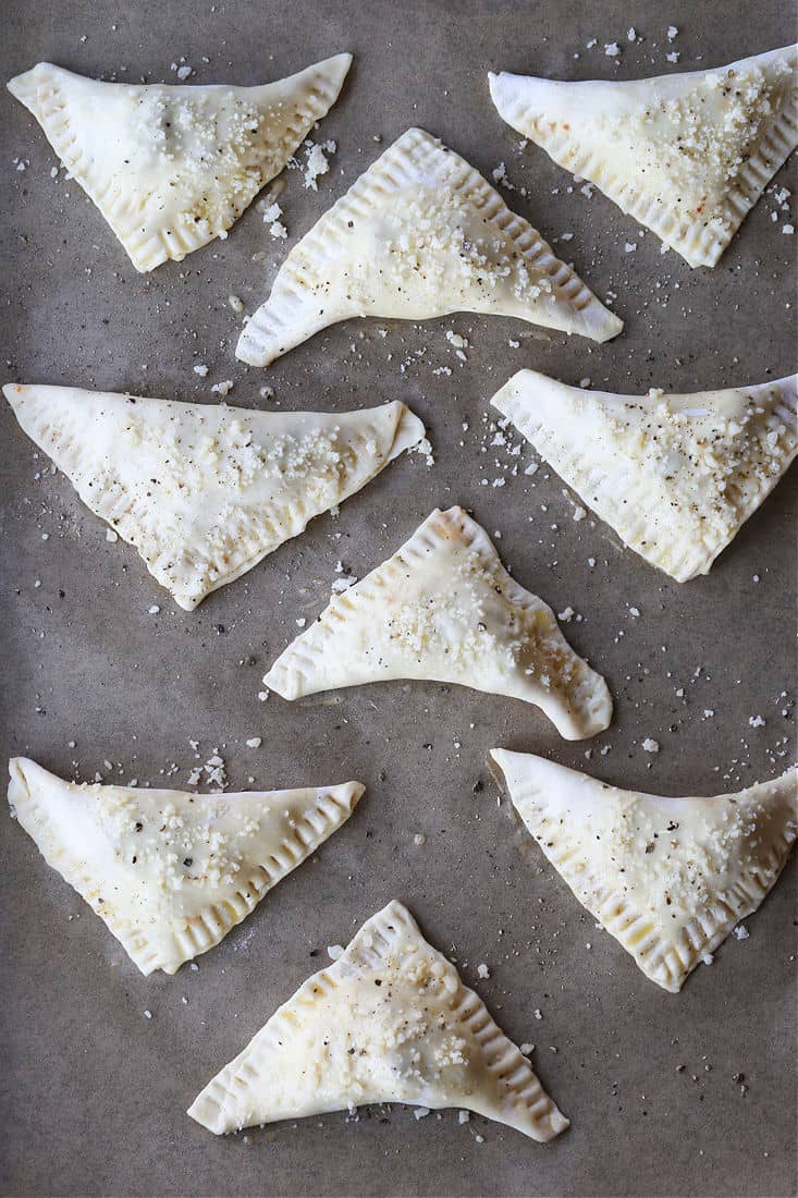 Puff pastry triangles filled with a sausage pizza filling