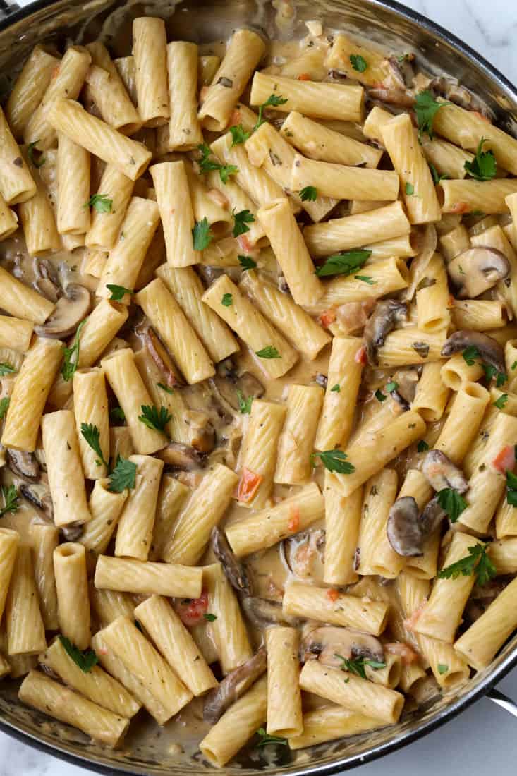 Pasta and mushrooms in a cream sauce in a large skillet