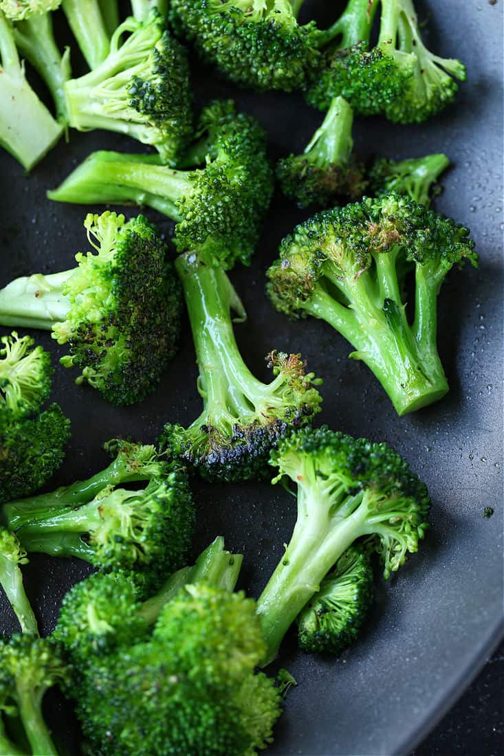This Ground Beef and Broccoli recipe is SO addicting! Our kids absolutely love this 15 minute dinner, and they always want seconds! Broccoli in a skillet for beef and broccoli recipe