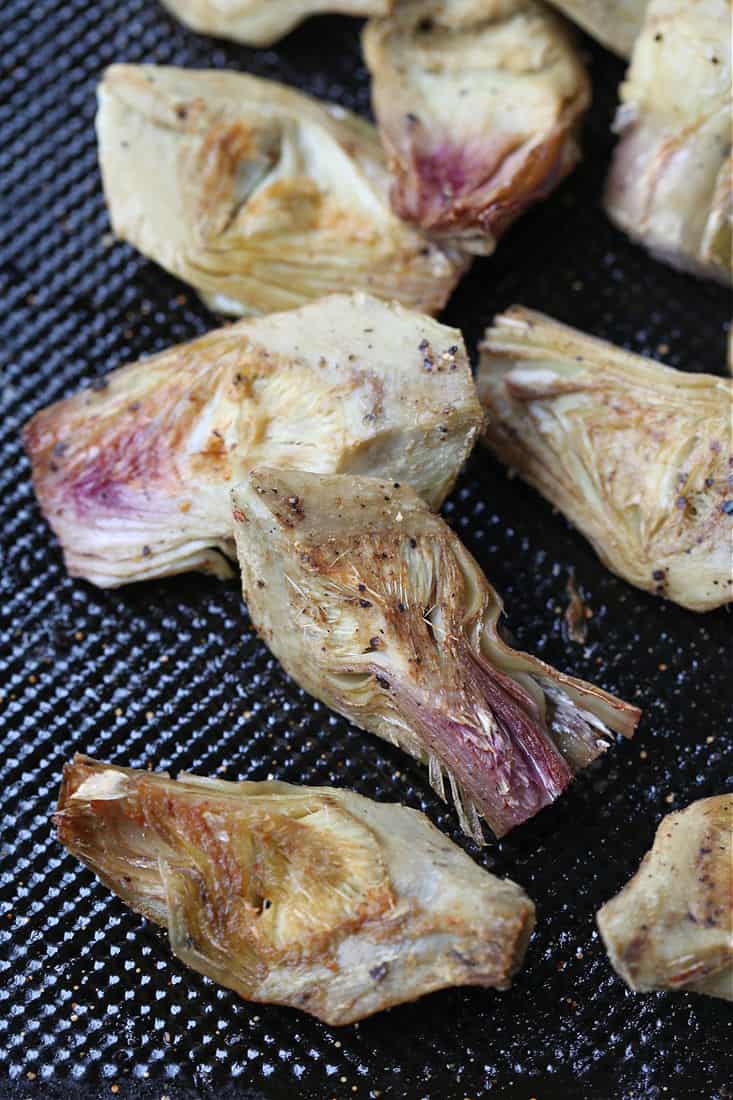 Roasted artichoke hearts on a sheet pan