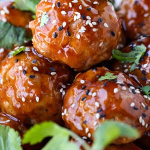 Teriyaki Meatballs in a bowl with sesame seeds and cilantro