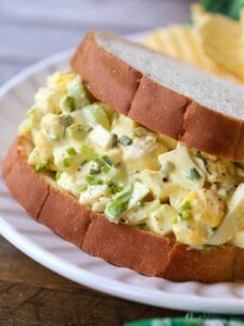 Egg salad sandwich on a white plate