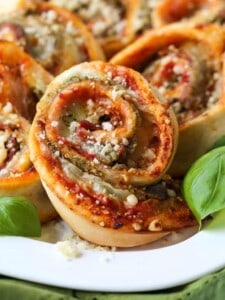 Pizza rolls stuffed with mozzarella cheese, basil pesto and prosciutto