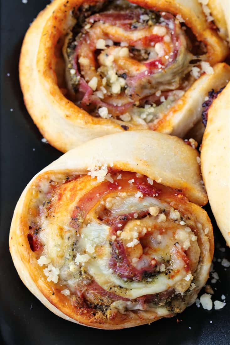 Caprese Pizza Pinwheels on a baking sheet