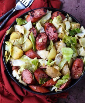 Kielbasa dinner with cabbage, potatoes and onions