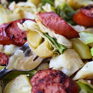 Cabbage, kielbasa and potatoes on a fork