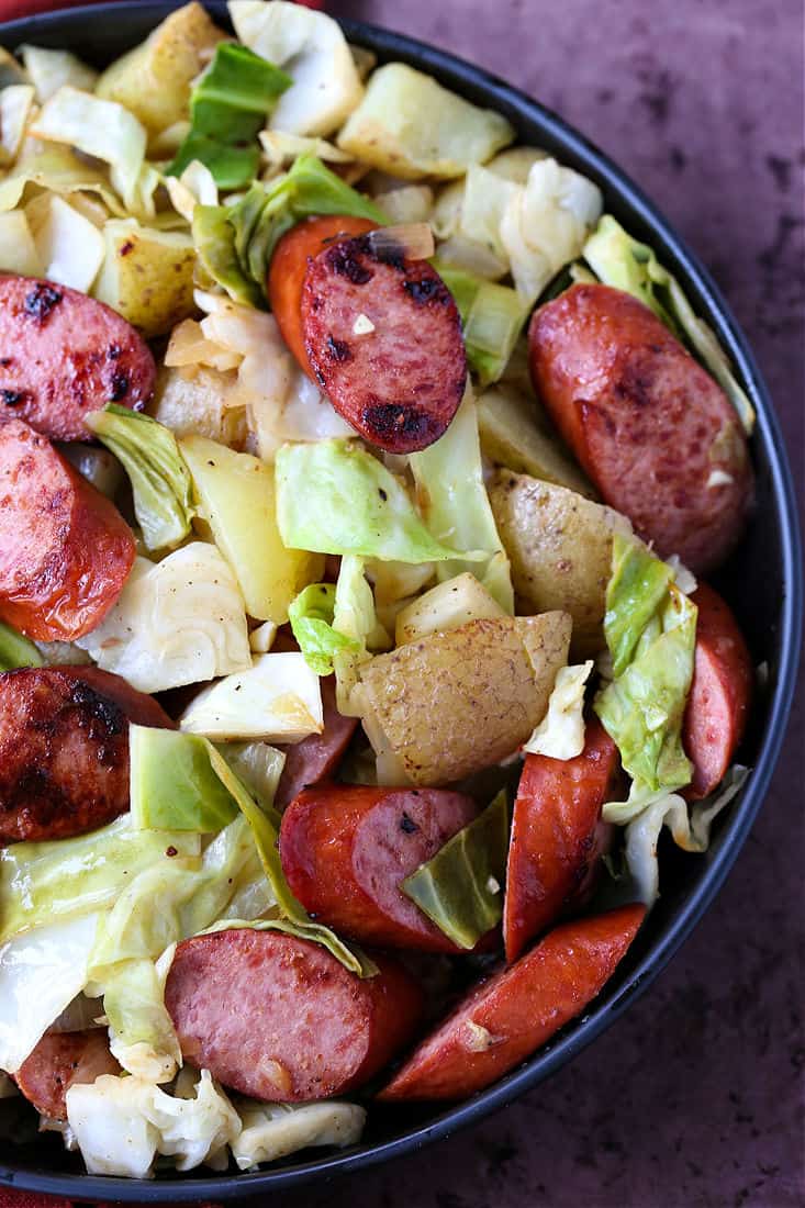 Kielbasa and Cabbage dinner with potatoes on a fork