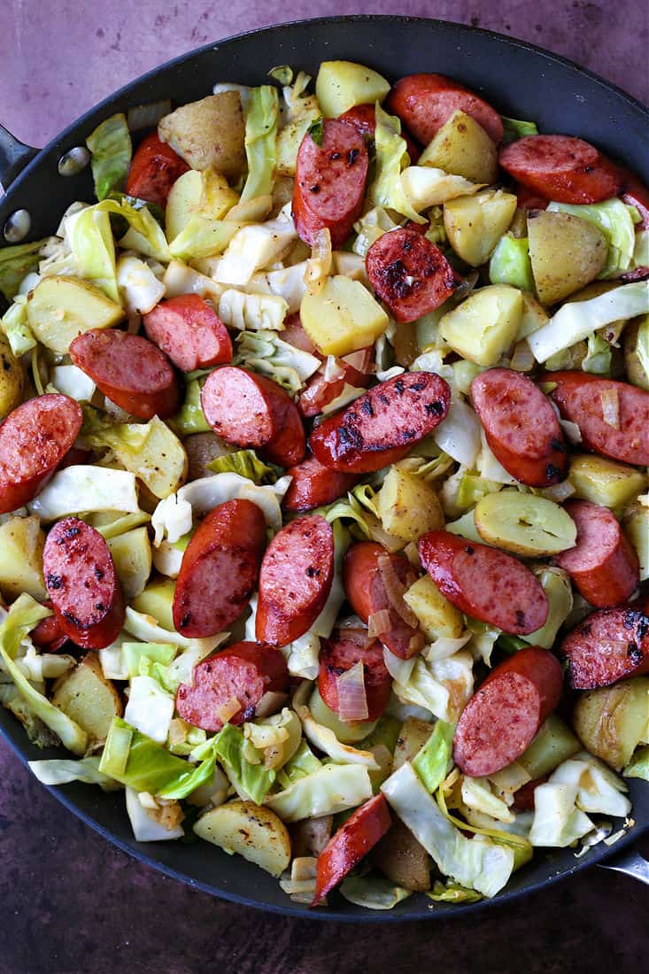 Cabbage, kielbasa and potatoes in a skillet