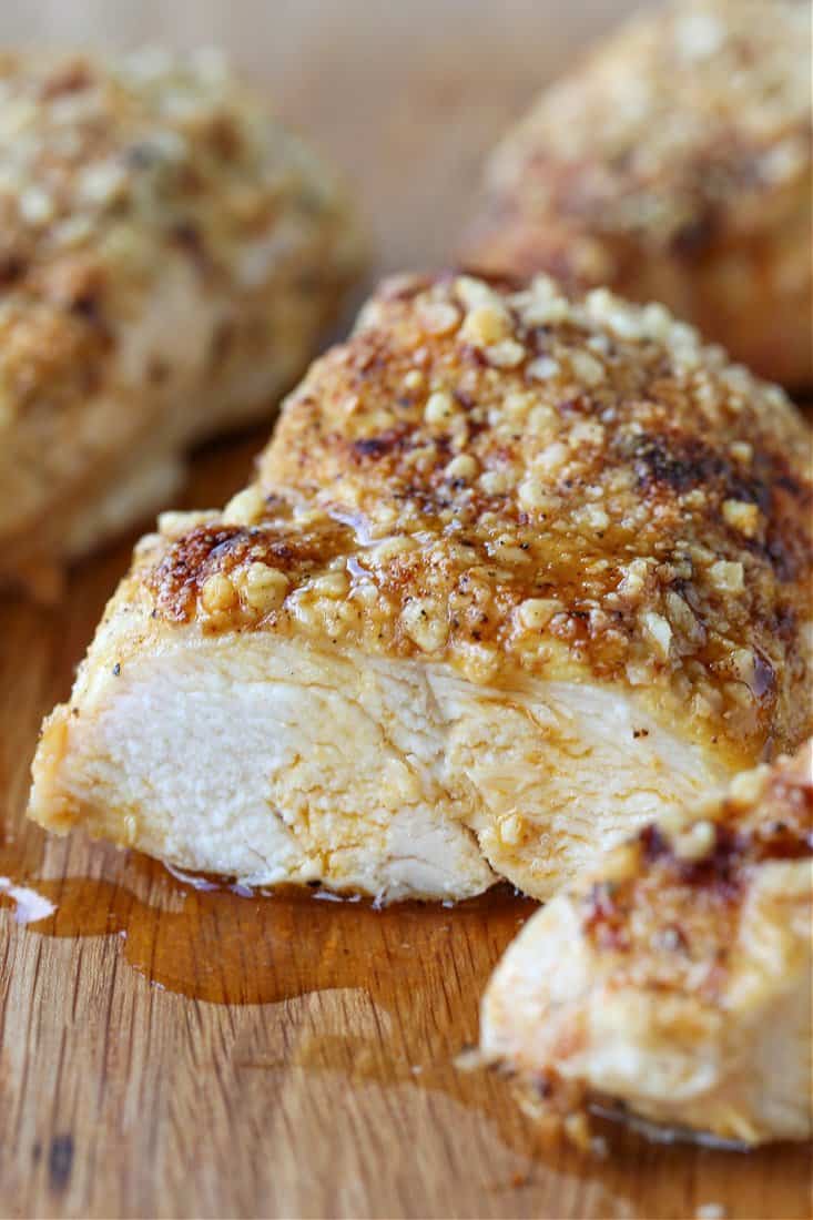 Baked chicken breasts with a parmesan cheese and mayonnaise coating