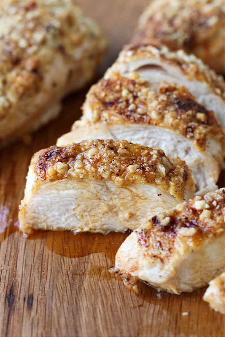 Sliced chicken breasts on a cutting board