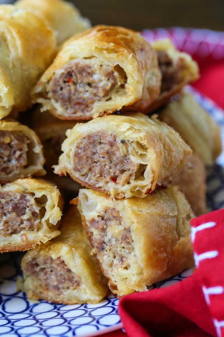 Sausage Rolls stacked on a plate