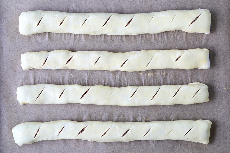 Puff pastry rolls filled with a sausage and cheese filling
