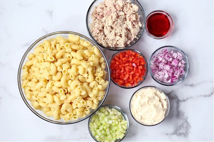 This creamy Tuna Pasta Salad is one of my favorite comfort foods! Perfect for bringing to a BBQ, potluck or for serving at any party! ingredients for making tuna pasta salad
