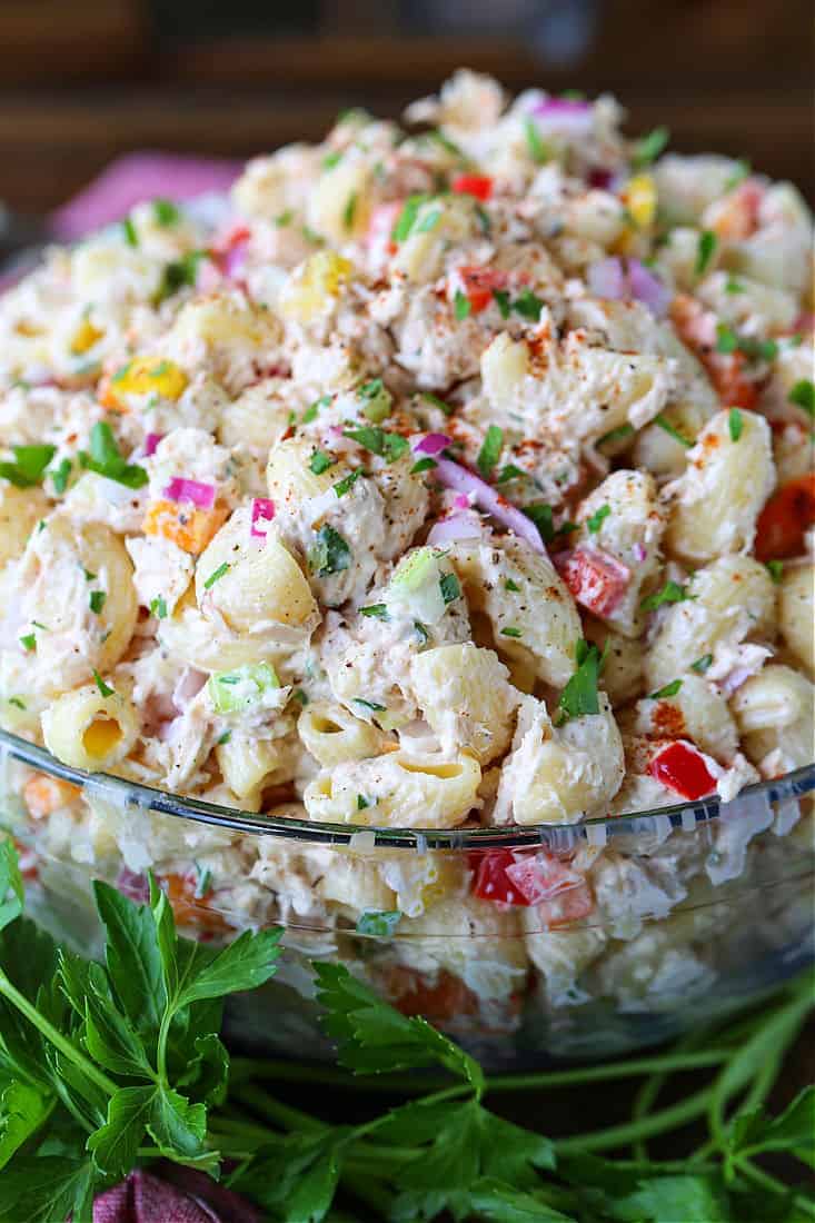 This creamy Tuna Pasta Salad is one of my favorite comfort foods! Perfect for bringing to a BBQ, potluck or for serving at any party! Tuna pasta salad in a large serving bowl
